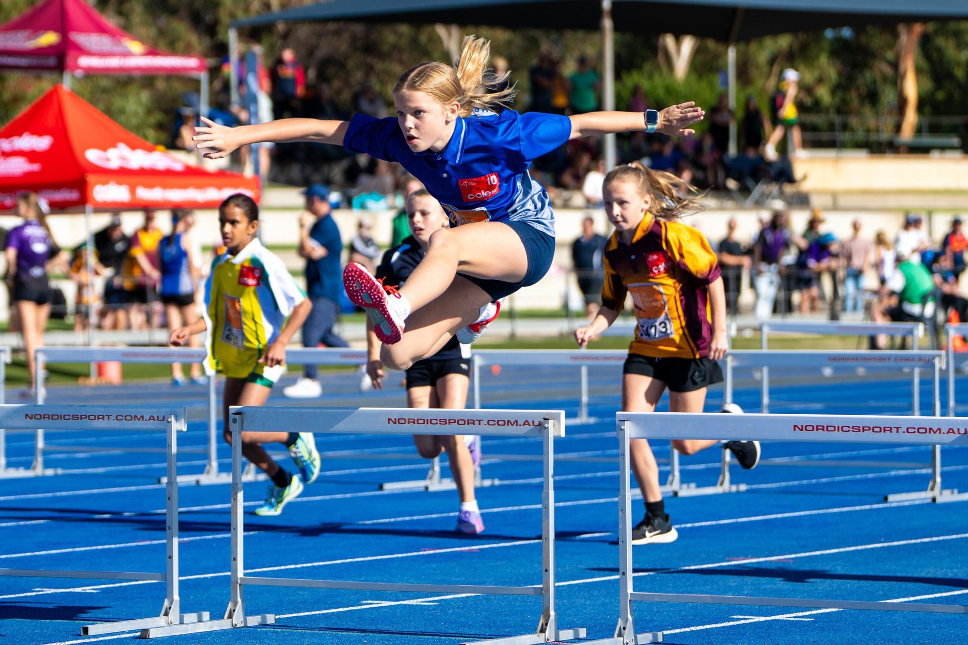 Plympton Flyers athlete competing at hurdles
